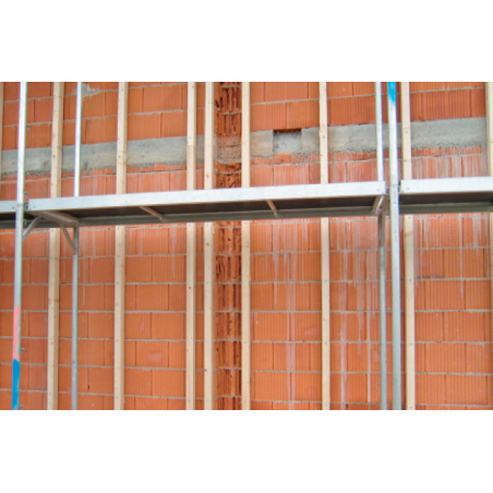 Aplicación del taco largo para mampostería HBR SSP en estructura de madera sobre pared de ladrillo